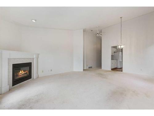 309 Sierra Morena Green Sw, Calgary, AB - Indoor Photo Showing Living Room With Fireplace