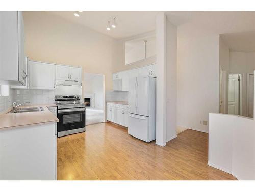 309 Sierra Morena Green Sw, Calgary, AB - Indoor Photo Showing Kitchen With Double Sink