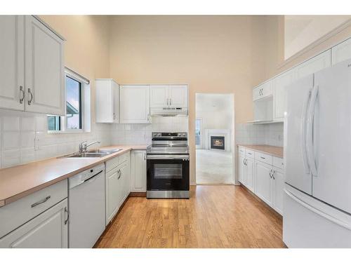 309 Sierra Morena Green Sw, Calgary, AB - Indoor Photo Showing Kitchen With Double Sink