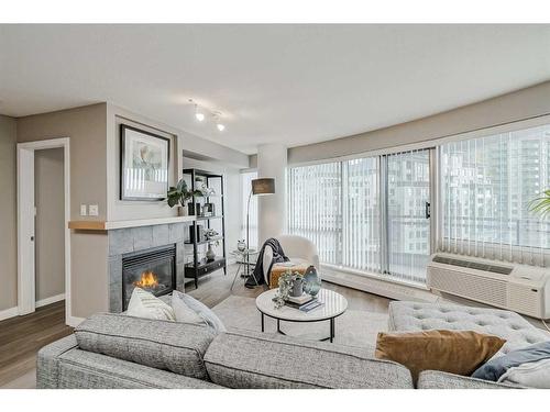 1705-1088 6 Avenue Sw, Calgary, AB - Indoor Photo Showing Living Room With Fireplace