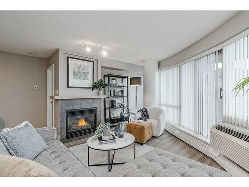 1705-1088 6 Avenue Sw, Calgary, AB - Indoor Photo Showing Living Room With Fireplace