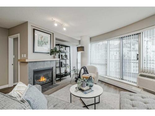 1705-1088 6 Avenue Sw, Calgary, AB - Indoor Photo Showing Living Room With Fireplace