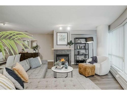 1705-1088 6 Avenue Sw, Calgary, AB - Indoor Photo Showing Living Room With Fireplace