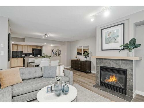 1705-1088 6 Avenue Sw, Calgary, AB - Indoor Photo Showing Living Room With Fireplace