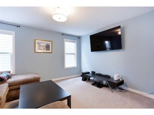 128 Sundown Way, Cochrane, AB - Indoor Photo Showing Living Room