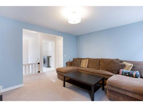 128 Sundown Way, Cochrane, AB - Indoor Photo Showing Living Room