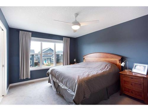 128 Sundown Way, Cochrane, AB - Indoor Photo Showing Bedroom