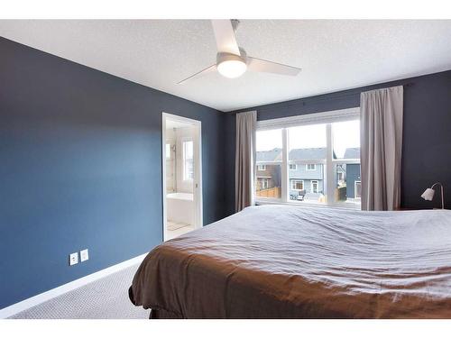 128 Sundown Way, Cochrane, AB - Indoor Photo Showing Bedroom