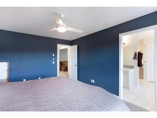 128 Sundown Way, Cochrane, AB - Indoor Photo Showing Bedroom