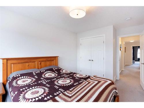 128 Sundown Way, Cochrane, AB - Indoor Photo Showing Bedroom