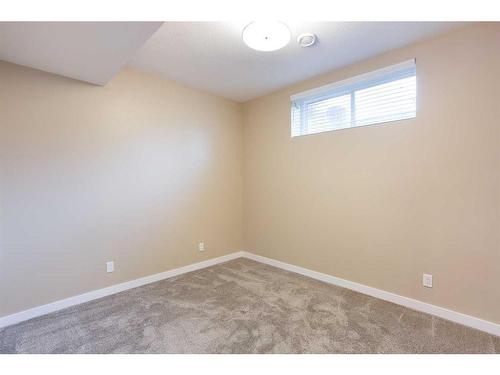 128 Sundown Way, Cochrane, AB - Indoor Photo Showing Other Room