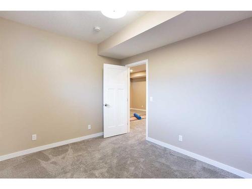 128 Sundown Way, Cochrane, AB - Indoor Photo Showing Other Room