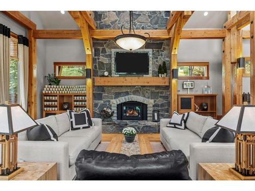 102 Cairns Landing, Canmore, AB - Indoor Photo Showing Living Room With Fireplace