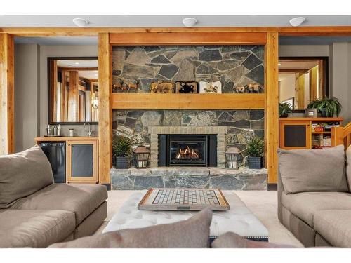 102 Cairns Landing, Canmore, AB - Indoor Photo Showing Living Room With Fireplace