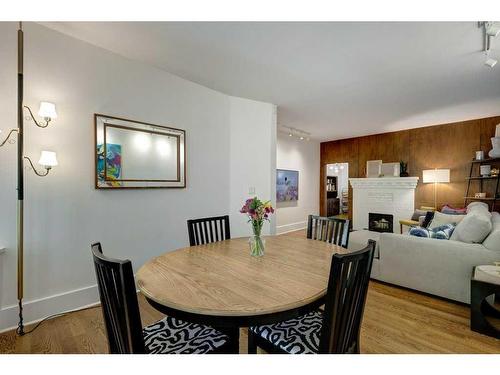 915 18 Avenue Sw, Calgary, AB - Indoor Photo Showing Dining Room With Fireplace