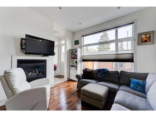 914 Remington Road Ne, Calgary, AB - Indoor Photo Showing Living Room With Fireplace