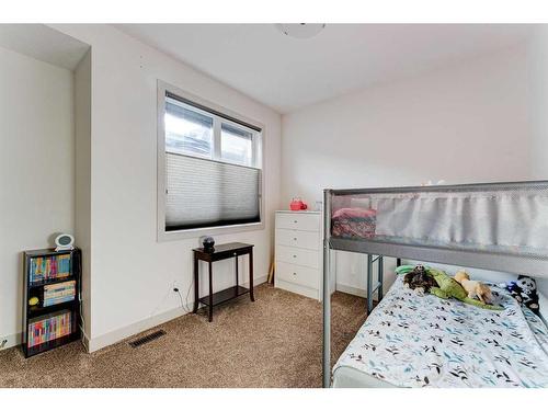 914 Remington Road Ne, Calgary, AB - Indoor Photo Showing Bedroom