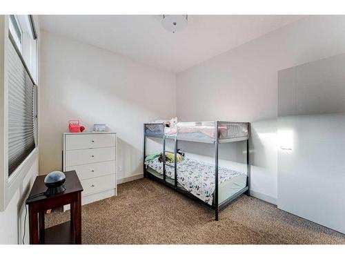 914 Remington Road Ne, Calgary, AB - Indoor Photo Showing Bedroom