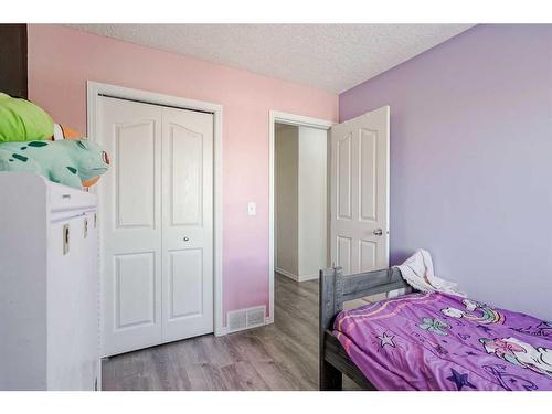 703-2001 Luxstone Boulevard Sw, Airdrie, AB - Indoor Photo Showing Bedroom