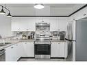 703-2001 Luxstone Boulevard Sw, Airdrie, AB  - Indoor Photo Showing Kitchen With Double Sink 