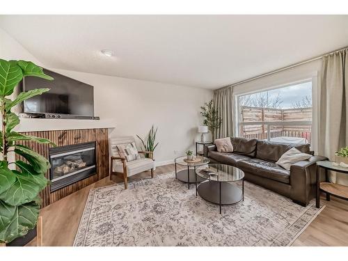 154 Rockbluff Close Nw, Calgary, AB - Indoor Photo Showing Living Room With Fireplace