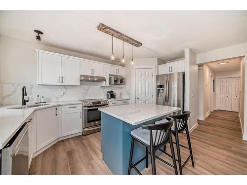 154 Rockbluff Close Nw, Calgary, AB - Indoor Photo Showing Kitchen With Upgraded Kitchen