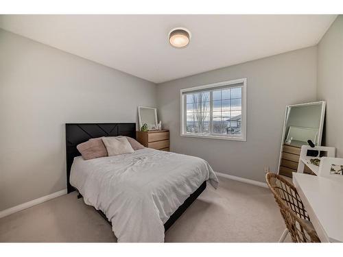 154 Rockbluff Close Nw, Calgary, AB - Indoor Photo Showing Bedroom