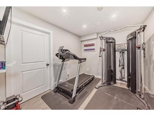 154 Rockbluff Close Nw, Calgary, AB - Indoor Photo Showing Gym Room