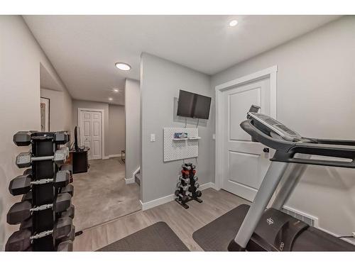 154 Rockbluff Close Nw, Calgary, AB - Indoor Photo Showing Gym Room