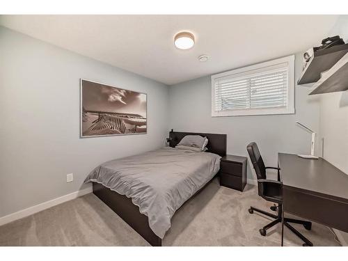 154 Rockbluff Close Nw, Calgary, AB - Indoor Photo Showing Bedroom