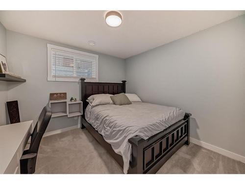 154 Rockbluff Close Nw, Calgary, AB - Indoor Photo Showing Bedroom