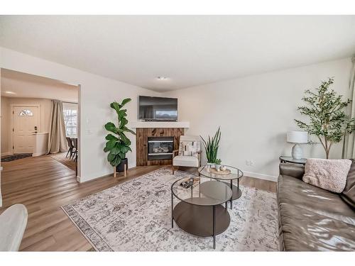 154 Rockbluff Close Nw, Calgary, AB - Indoor Photo Showing Living Room With Fireplace