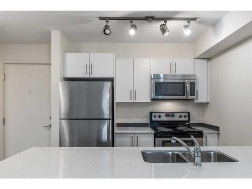 4207-181 Skyview Ranch Manor Ne, Calgary, AB - Indoor Photo Showing Kitchen With Stainless Steel Kitchen With Double Sink With Upgraded Kitchen