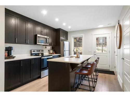 214-338 Seton Circle Se, Calgary, AB - Indoor Photo Showing Kitchen With Stainless Steel Kitchen With Upgraded Kitchen