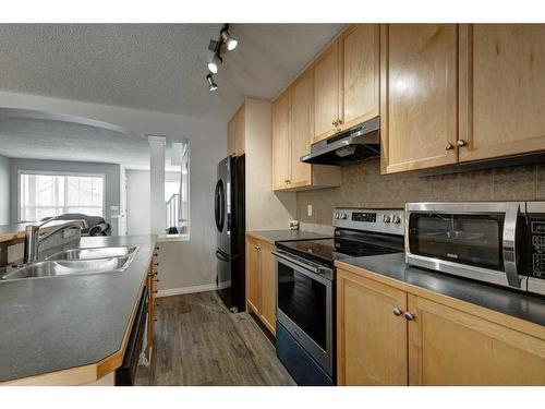 51 Prestwick Bay Se, Calgary, AB - Indoor Photo Showing Kitchen With Double Sink