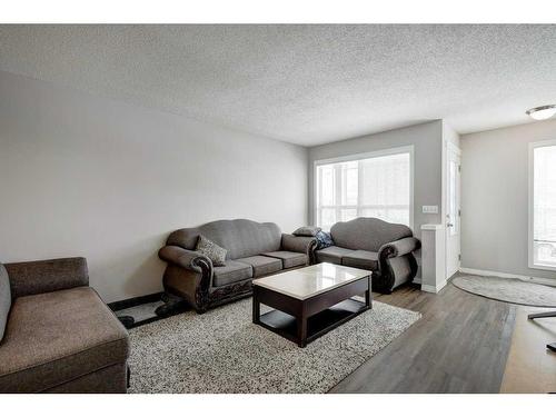 51 Prestwick Bay Se, Calgary, AB - Indoor Photo Showing Living Room