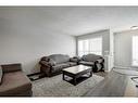 51 Prestwick Bay Se, Calgary, AB  - Indoor Photo Showing Living Room 