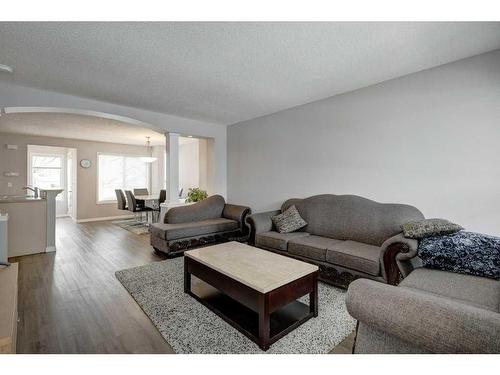 51 Prestwick Bay Se, Calgary, AB - Indoor Photo Showing Living Room