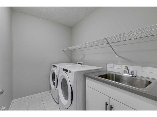 16 Walgrove Rise Se, Calgary, AB - Indoor Photo Showing Laundry Room