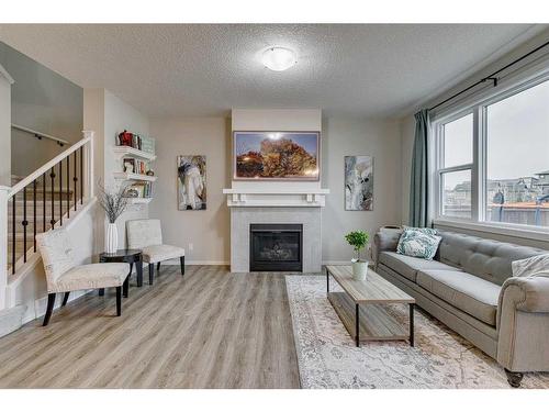 16 Walgrove Rise Se, Calgary, AB - Indoor Photo Showing Living Room With Fireplace