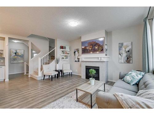 16 Walgrove Rise Se, Calgary, AB - Indoor Photo Showing Living Room With Fireplace