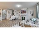 16 Walgrove Rise Se, Calgary, AB  - Indoor Photo Showing Living Room With Fireplace 