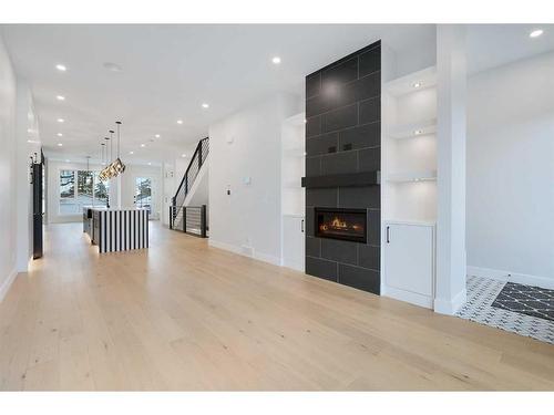 711 36 Street Sw, Calgary, AB - Indoor Photo Showing Other Room With Fireplace