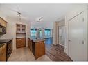 619-8880 Horton Road Sw, Calgary, AB  - Indoor Photo Showing Kitchen With Double Sink 