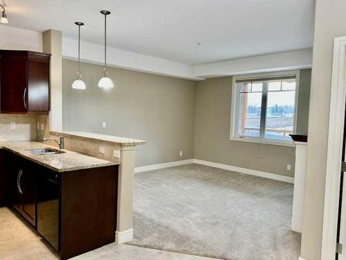 1239-2330 Fish Creek Boulevard Sw, Calgary, AB - Indoor Photo Showing Kitchen