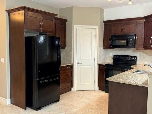 1239-2330 Fish Creek Boulevard Sw, Calgary, AB - Indoor Photo Showing Kitchen