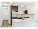 114-305 18 Avenue Sw, Calgary, AB  - Indoor Photo Showing Kitchen With Double Sink With Upgraded Kitchen 