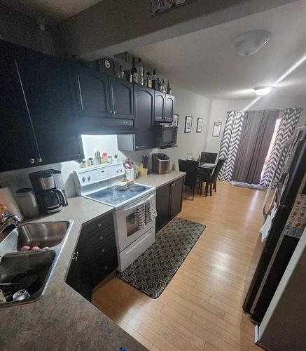 1201 Eagleview Place Nw, High River, AB - Indoor Photo Showing Kitchen With Double Sink