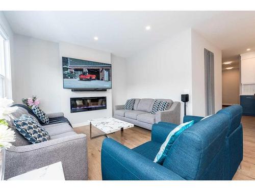 61 Calhoun Crescent Ne, Calgary, AB - Indoor Photo Showing Living Room With Fireplace