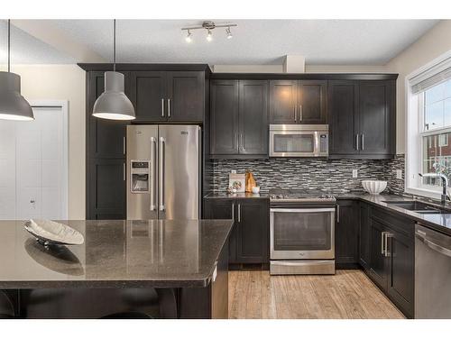 299 Mahogany Boulevard Se, Calgary, AB - Indoor Photo Showing Kitchen With Stainless Steel Kitchen With Double Sink With Upgraded Kitchen